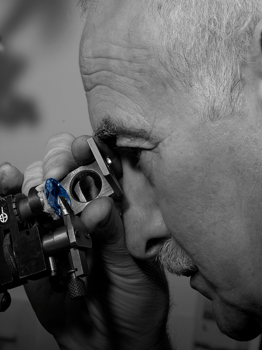 A Graff master craftsman examines the facets of the Wittelsbach-Graff Diamond during its restoration